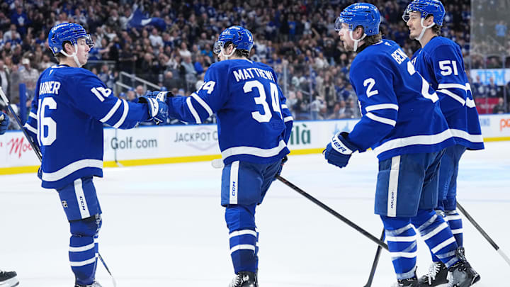 Apr 5, 2025; Toronto, Ontario, CAN; Toronto Maple Leafs center Auston Matthews (34) scores a goal and celebrates with right wing Mitch Marner (16) against the Columbus Blue Jackets during the third period at Scotiabank Arena. Mandatory Credit: Nick Turchiaro-Imagn Images