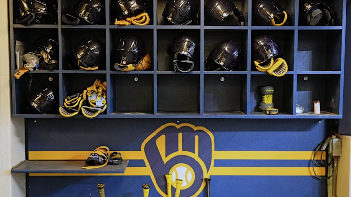 Apr 5, 2025; Milwaukee, Wisconsin, USA;  General view of Milwaukee Brewers batting helmets in the dugout prior to the game against the Cincinnati Reds at American Family Field. Mandatory Credit: Jeff Hanisch-Imagn Images