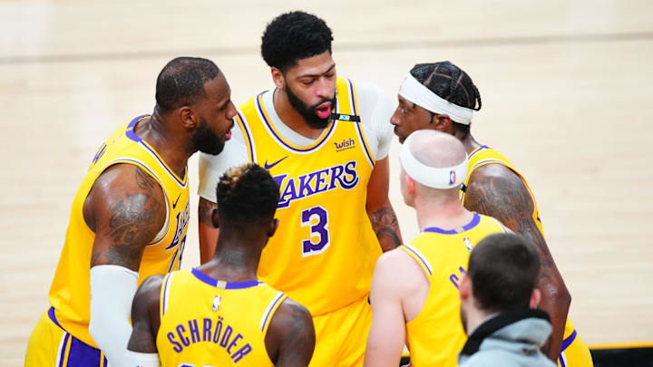 May 25, 2021; Phoenix, Arizona, USA; Los Angeles Lakers forward LeBron James (23) in the huddle with Anthony Davis (3), guard Kentavious Caldwell-Pope (1), Dennis Schroder (17) and Alex Caruso (4) against the Phoenix Suns during game two of the first round of the 2021 NBA Playoffs at Phoenix Suns Arena. Mandatory Credit: Mark J. Rebilas-Imagn Images