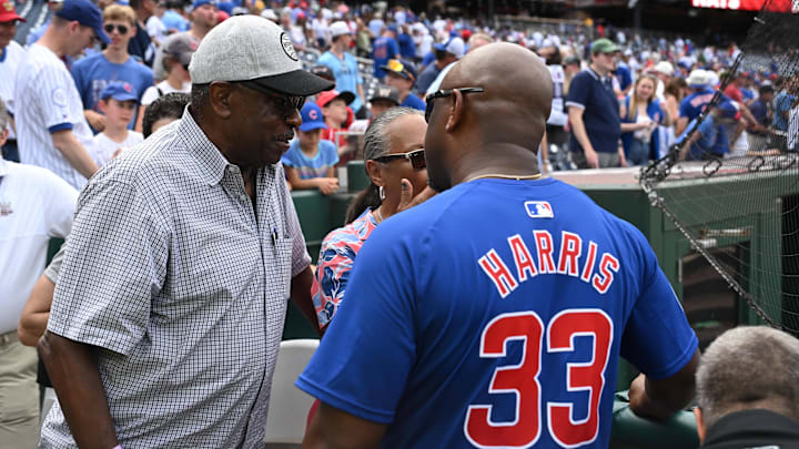 Sep 1, 2024; Washington, District of Columbia, USA; Former Washington Nationals manager Dusty Baker talks with Chicago Cubs third base coach Willie Harris (33) after a game between the Washington Nationals and the Chicago Cubs at Nationals Park. Mandatory Credit: Rafael Suanes-Imagn Images Sep 1, 2024; Washington, District of Columbia, USA; Former Washington Nationals manager Dusty Baker talks with Chicago Cubs third base coach Willie Harris (33) after a game between the Washington Nationals and the Chicago Cubs at Nationals Park. Mandatory Credit: Rafael Suanes-Imagn Images