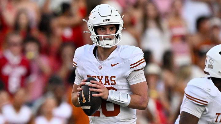 Texas Longhorns quarterback Arch Manning runs with the ball during the game between the Sooners and the Longhorns Texas Longhorns quarterback Arch Manning runs with the ball during the game between the Sooners and the Longhorns
