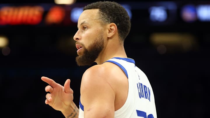 Apr 17, 2026; Phoenix, Arizona, USA; Golden State Warriors guard Stephen Curry (30) against the Phoenix Suns during the play-in rounds of the 2026 NBA Playoffs at Mortgage Matchup Center.