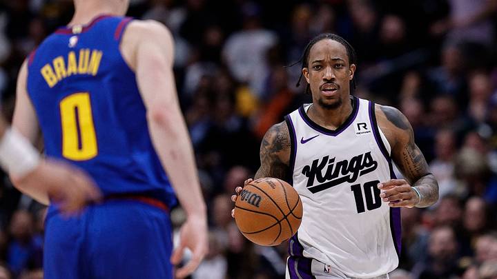 Mar 5, 2025; Denver, Colorado, USA; Sacramento Kings forward DeMar DeRozan (10) controls the ball as Denver Nuggets guard Christian Braun (0) guards in the fourth quarter at Ball Arena. Mandatory Credit: Isaiah J. Downing-Imagn Images Mar 5, 2025; Denver, Colorado, USA; Sacramento Kings forward DeMar DeRozan (10) controls the ball as Denver Nuggets guard Christian Braun (0) guards in the fourth quarter at Ball Arena. Mandatory Credit: Isaiah J. Downing-Imagn Images