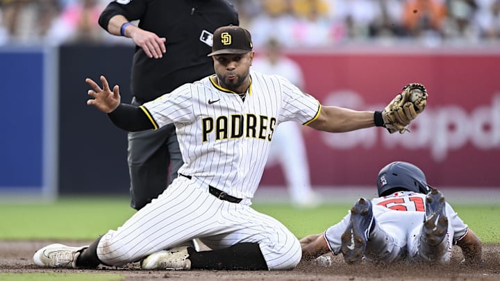 Jun 23, 2025; San Diego, California, USA; Washington Nationals right fielder Daylen Lile (51) is tagged out by San Diego Padres shortstop Xander Bogaerts (2) as he tries to steal second base during the third inning at Petco Park. Mandatory Credit: Denis Poroy-Imagn Images Jun 23, 2025; San Diego, California, USA; Washington Nationals right fielder Daylen Lile (51) is tagged out by San Diego Padres shortstop Xander Bogaerts (2) as he tries to steal second base during the third inning at Petco Park. Mandatory Credit: Denis Poroy-Imagn Images