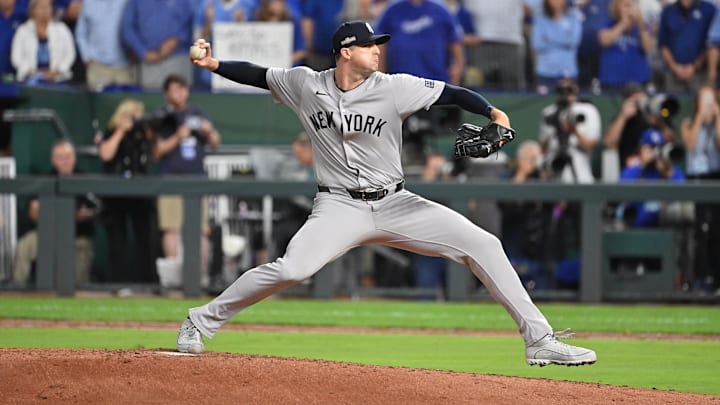 Oct 9, 2024; Kansas City, Missouri, USA; New York Yankees relief pitcher Clay Holmes (35) pitches in the in the fifth inning against the Kansas City Royals during game three of the NLDS for the 2024 MLB Playoffs at Kauffman Stadium. Mandatory Credit: Peter Aiken-Imagn Images