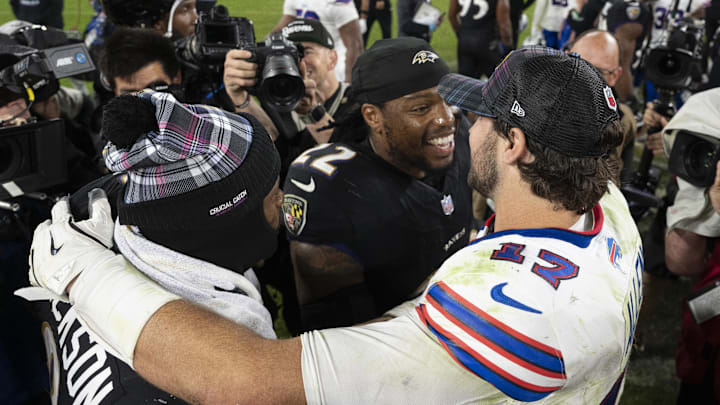 Buffalo Bills quarterback Josh Allen (17) speaks with Baltimore Ravens running back Derrick Henry (22) and quarterback Lamar Jackson (8) after the game during the second half at M&;T Bank Stadium