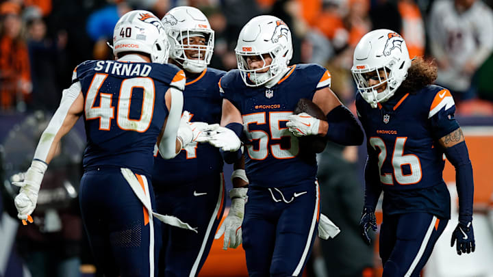 Dec 2, 2024; Denver, Colorado, USA; Denver Broncos linebacker Cody Barton (55) celebrates his interception with linebacker Justin Strnad (40) and defensive tackle Jordan Jackson (94) and safety Devon Key (26) in the fourth quarter against the Cleveland Browns at Empower Field at Mile High. 