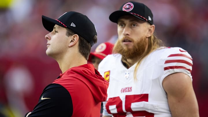 Jan 5, 2025; Glendale, Arizona, USA; San Francisco 49ers quarterback Brock Purdy (left) with tight end George Kittle (85) against the Arizona Cardinals at State Farm Stadium. Mandatory Credit: Mark J. Rebilas-Imagn Images