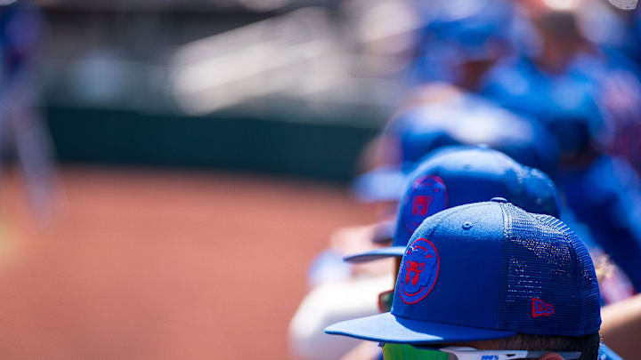 Mar 18, 2023; Scottsdale, Arizona, USA;  A general view hats belonging to Chicago Cubs players in the dugout during the first inning during a spring training game against the San Fracisco Giants at Scottsdale Stadium. Mandatory Credit: Allan Henry-Imagn Images.