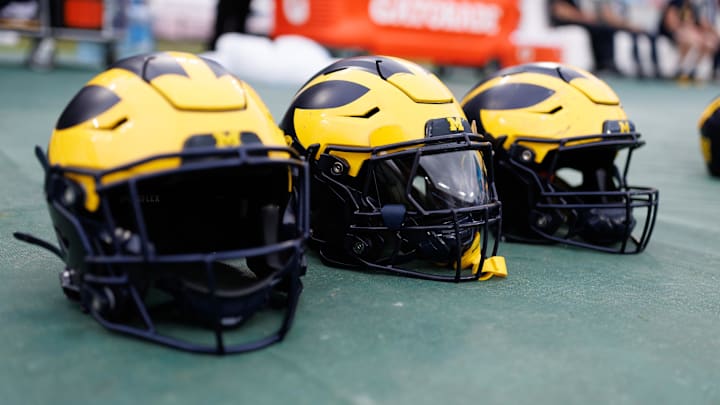 Dec 31, 2024; Tampa, FL, USA; Michigan Wolverines helmets sit on the field before a game against the Alabama Crimson Tide at Raymond James Stadium. Mandatory Credit: Matt Pendleton-Imagn Images Dec 31, 2024; Tampa, FL, USA; Michigan Wolverines helmets sit on the field before a game against the Alabama Crimson Tide at Raymond James Stadium. Mandatory Credit: Matt Pendleton-Imagn Images
