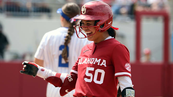 Oklahoma second baseman Ailana Agbayani smiles after reaching on a hit against Kentucky at Love's Field.