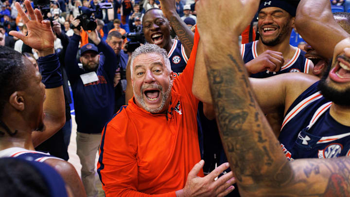 Mar 1, 2025; Lexington, Kentucky, USA; Auburn Tigers head coach Bruce Pearl celebrates with his players on the court after the game against the Kentucky Wildcats at Rupp Arena at Central Bank Center. Mandatory Credit: Jordan Prather-Imagn Images