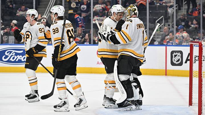 Dec 31, 2025; Edmonton, Alberta, CAN; Boston Bruins right winger David Pastrnak (88) center Fraser Minten (93) defenseman Hampus Lindholm (27) and goalie Jeremy Swayman (1) celebrate a win over the Edmonton Oilers at Rogers Place. Mandatory Credit: Walter Tychnowicz-Imagn Images Dec 31, 2025; Edmonton, Alberta, CAN; Boston Bruins right winger David Pastrnak (88) center Fraser Minten (93) defenseman Hampus Lindholm (27) and goalie Jeremy Swayman (1) celebrate a win over the Edmonton Oilers at Rogers Place. Mandatory Credit: Walter Tychnowicz-Imagn Images