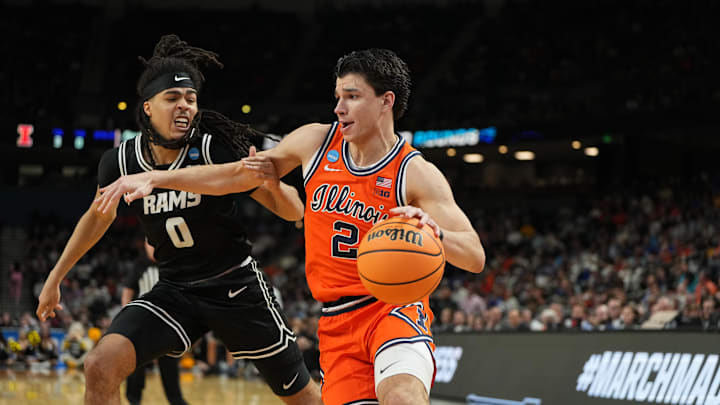Mar 21, 2026; Greenville, SC, USA; VCU Rams guard Brandon Jennings (0) defends against Illinois Fighting Illini guard Andrej Stojakovic (2) during the second half during a second round game of the men's 2026 NCAA Tournament at Bon Secours Wellness Arena. Mandatory Credit: Bob Donnan-Imagn Images