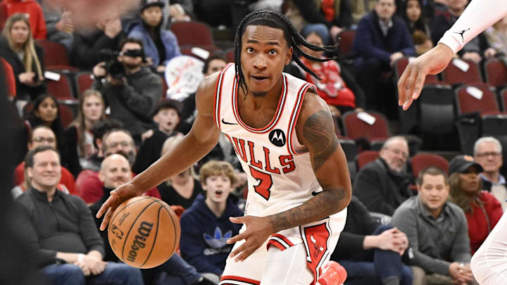 Feb 24, 2026; Chicago, Illinois, USA; Chicago Bulls guard Rob Dillingham (7) dribbles against Charlotte Hornets forward Xavier Tillman (26) during the second half at United Center. Mandatory Credit: Matt Marton-Imagn Images