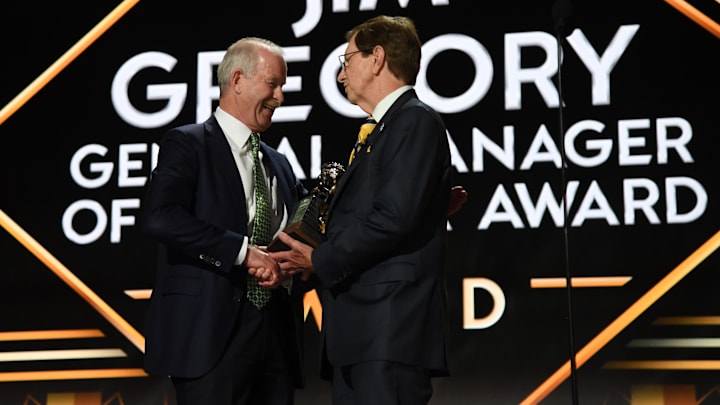 Jun 28, 2023; Nashville, Tennessee, USA; Dallas Stars general manager Jim Nill is awarded the Jim Gregory General Manager of the Year award by Nashville Predators general manager David Poile during the first round of the 2023 NHL Draft at Bridgestone Arena. Mandatory Credit: Christopher Hanewinckel-Imagn Images