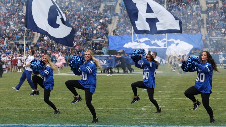 Nov 18, 2023; Provo, Utah, USA;  The Brigham Young Cougars cheer team perform between the third and fourth quarters against the Oklahoma Sooners at LaVell Edwards Stadium. Mandatory Credit: Rob Gray-USA TODAY Sports