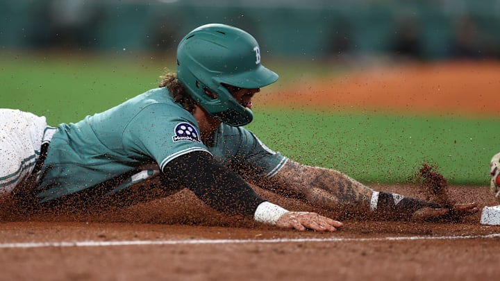 Apr 17, 2026; Boston, Massachusetts, USA; Boston Red Sox left fielder Jarren Duran (16) steals third base during the tenth inning against the Detroit Tigers at Fenway Park. Mandatory Credit: Paul Rutherford-Imagn Images