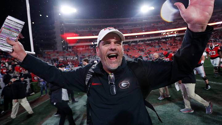 Georgia Offensive Coordinator Mike Bobo celebrates after wining a NCAA college football game against Ole Miss in Athens, Ga., on Saturday, Nov. 11, 2023. Georgia won 52-17.