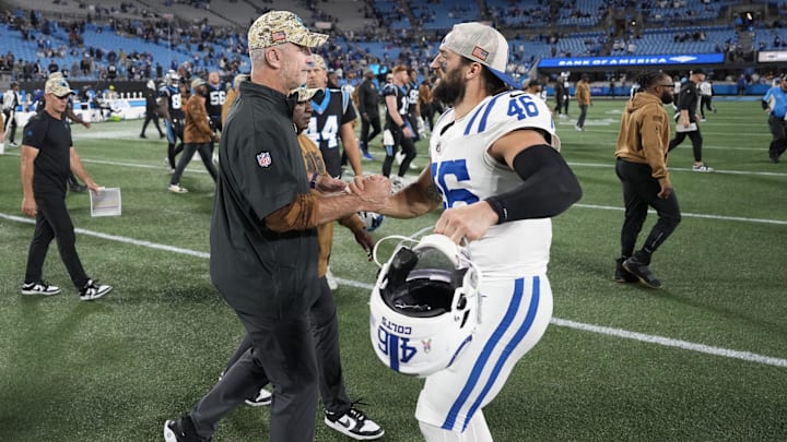 Nov 5, 2023; Charlotte, North Carolina, USA; Carolina Panthers head coach Frank Reich with Indianapolis Colts long snapper Luke Rhodes (46) after the game at Bank of America Stadium
