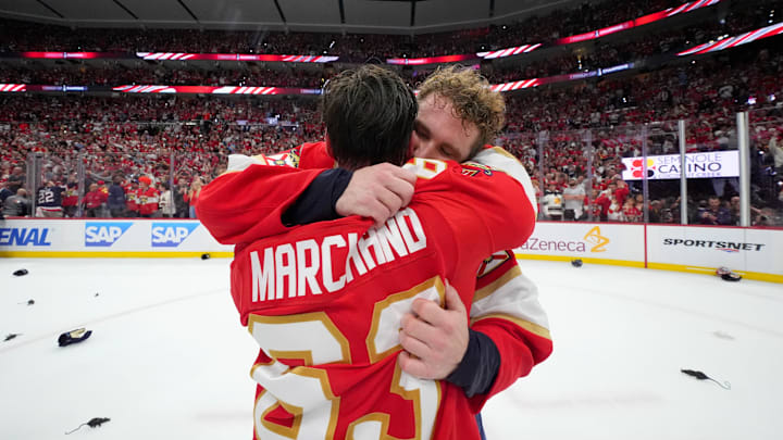 Matthew Tkachuk and Brad Marchand hug after the Florida Panthers win the 2025 Stanley Cup Final.