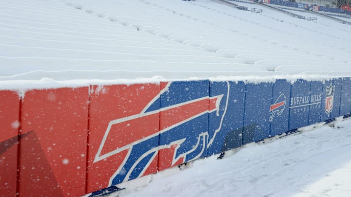 Highmark Stadium seats are covered with snow.
