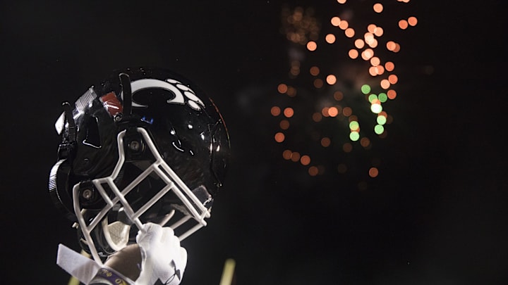 Cincinnati Bearcats player lifts his helmet after the Birmingham Bowl between Cincinnati Bearcats and Boston College Eagles on Thursday, Jan. 2, 2020, at Legion Field in Birmingham, Ala. Cincinnati Bearcats wont 38-6.

Birmingham Bowl