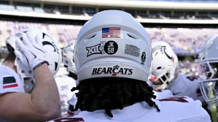 Nov 29, 2025; Fort Worth, Texas, USA; A view of the JK 58 decal on the back of the helmet of Cincinnati Bearcats defensive end Mikah Coleman (4) before the game at Amon G. Carter Stadium. Mandatory Credit: Jerome Miron-Imagn Images Nov 29, 2025; Fort Worth, Texas, USA; A view of the JK 58 decal on the back of the helmet of Cincinnati Bearcats defensive end Mikah Coleman (4) before the game at Amon G. Carter Stadium. Mandatory Credit: Jerome Miron-Imagn Images