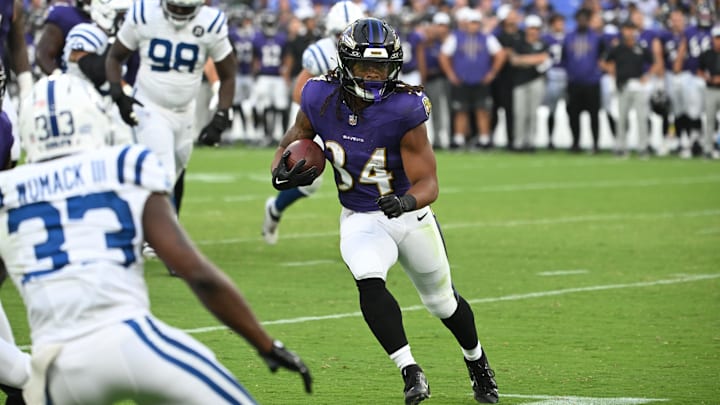 Aug 7, 2025; Baltimore, Maryland, USA; Baltimore Ravens running back Keaton Mitchell (34) runs to the end zone for a touchdown  against the Indianapolis Colts during the first quarter at M&T Bank Stadium. Mandatory Credit: Rafael Suanes-Imagn Images