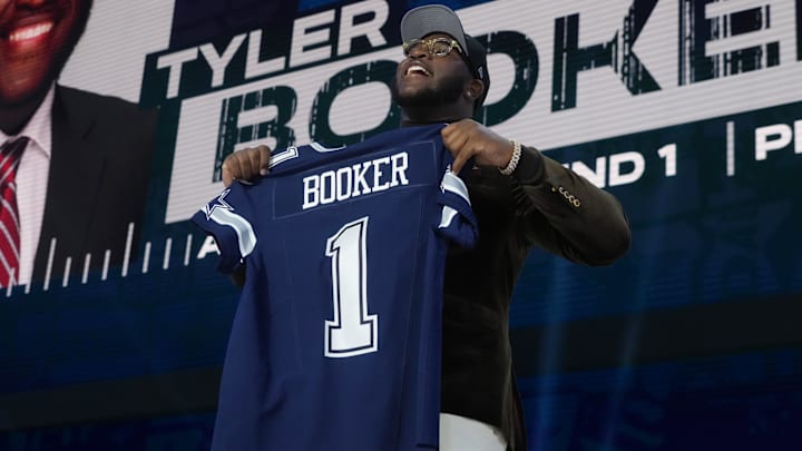 Alabama Crimson Tide G Tyler Booker is selected by the Dallas Cowboys in the first round of the 2025 NFL Draft at Lambeau Field. Alabama Crimson Tide G Tyler Booker is selected by the Dallas Cowboys in the first round of the 2025 NFL Draft at Lambeau Field.