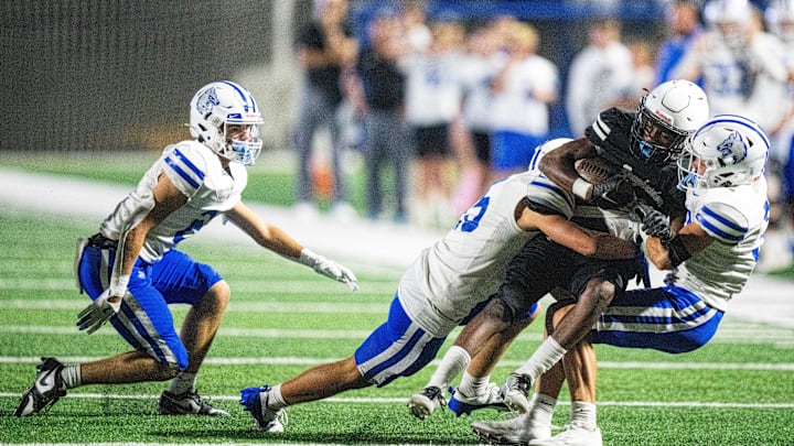 The Waukee Northwest defense makes a stop on the Roosevelt offense on Thursday, Sept. 12, 2024, at Mediacom Stadium in Des Moines.