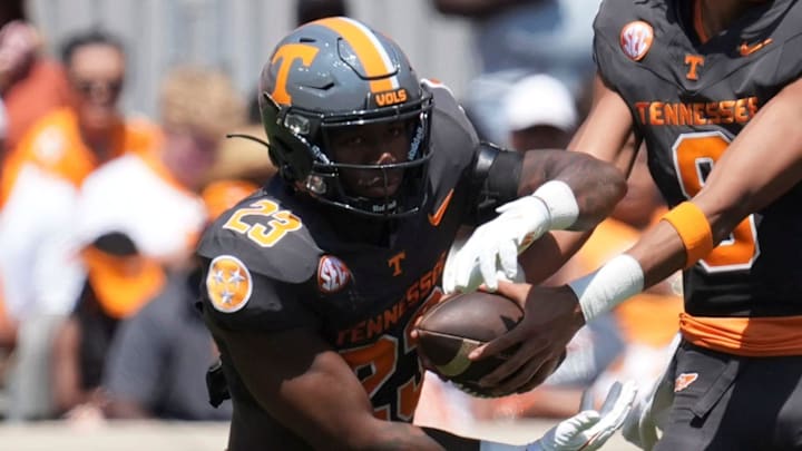 Tennessee quarterback Nico Iamaleava (8) hands the ball off to Tennessee running back Cameron Seldon (23) during a game between Tennessee and Chattanooga, Saturday, Aug. 31, 2024.