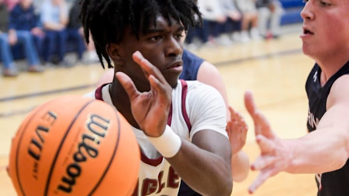 Alabama Christian's Darrius Gardner (23) is defended by Trinity's John Morris (5) in AHSAA Area Tournament action at the Montgomery Academy campus in Montgomery, Ala., on Monday February 5, 2024.