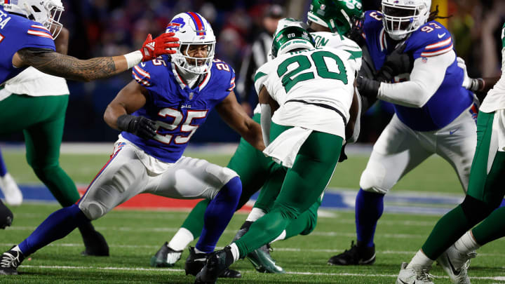 Buffalo Bills linebacker Tyrel Dodson (25) and Buffalo Bills defensive tackle Linval Joseph (93) team up to tackle New York Jets running back Breece Hall (20). Buffalo Bills linebacker Tyrel Dodson (25) and Buffalo Bills defensive tackle Linval Joseph (93) team up to tackle New York Jets running back Breece Hall (20).