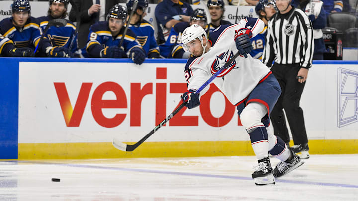 Oct 1, 2024; St. Louis, Missouri, USA;  Columbus Blue Jackets defenseman David Jiricek (55) shoots against the St. Louis Blues during the first period at Enterprise Center. Mandatory Credit: Jeff Curry-Imagn Images