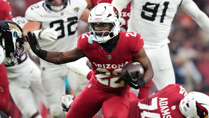 Arizona Cardinals running back Michael Carter (22) breaks out of the backfield against the Jacksonville Jaguars at State Farm Stadium on Nov. 23, 2025. Arizona Cardinals running back Michael Carter (22) breaks out of the backfield against the Jacksonville Jaguars at State Farm Stadium on Nov. 23, 2025.