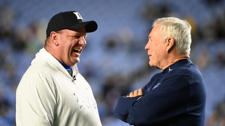 Nov 11, 2023; Chapel Hill, North Carolina, USA; Duke Blue Devils head coach Mike Elko with North Carolina Tar Heels head coach Mack Brown before the game at Kenan Memorial Stadium. Mandatory Credit: Bob Donnan-USA TODAY Sports