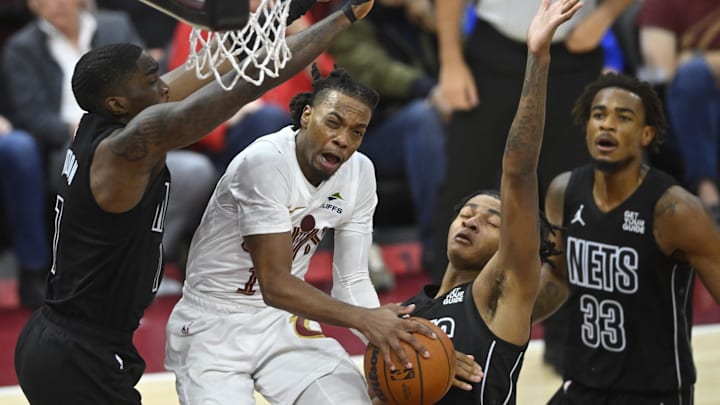 Nov 9, 2024; Cleveland, Ohio, USA; Cleveland Cavaliers guard Darius Garland (10) drives between three Brooklyn Nets defenders in the third quarter at Rocket Mortgage FieldHouse. Mandatory Credit: David Richard-Imagn Images Nov 9, 2024; Cleveland, Ohio, USA; Cleveland Cavaliers guard Darius Garland (10) drives between three Brooklyn Nets defenders in the third quarter at Rocket Mortgage FieldHouse. Mandatory Credit: David Richard-Imagn Images