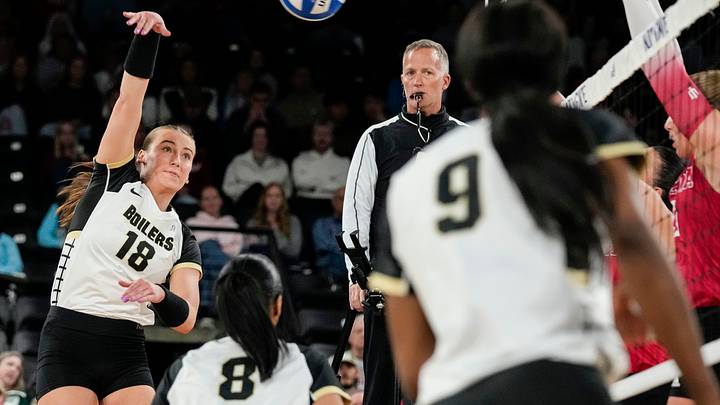 Purdue Boilermakers outside hitter Addy Tindall (18) hits the ball. Purdue Boilermakers outside hitter Addy Tindall (18) hits the ball.