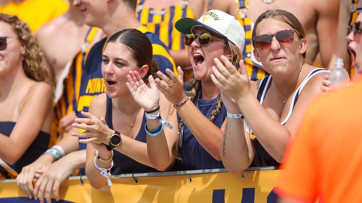 Sep 12, 2026; Morgantown, West Virginia, USA;  West Virginia Mountaineers fans cheer after a touchdown during the first quarter against the UT Martin Skyhawks at Milan Puskar Stadium.  Mandatory Credit: Ben Queen-Imagn Images