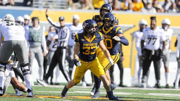 Nov 8, 2025; Morgantown, West Virginia, USA; West Virginia Mountaineers linebacker Ben Bogle (32) celebrates after a sack during the first quarter against the Colorado Buffaloes at Milan Puskar Stadium. Mandatory Credit: Ben Queen-Imagn Images