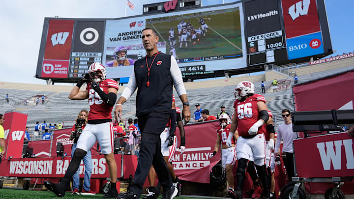 Sep 20, 2025; Madison, Wisconsin, USA;  Wisconsin Badgers head coach Luke Fickell walks onto the field prior to the game against the Maryland Terrapins at Camp Randall Stadium. Mandatory Credit: Jeff Hanisch-Imagn Images