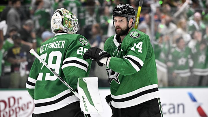 May 25, 2024; Dallas, Texas, USA; Dallas Stars goaltender Jake Oettinger (29) and left wing Jamie Benn (14) on the ice after the Dallas Stars defeat the Edmonton Oilers in game two of the Western Conference Final of the 2024 Stanley Cup Playoffs at American Airlines Center. Mandatory Credit: Jerome Miron-USA TODAY Sports