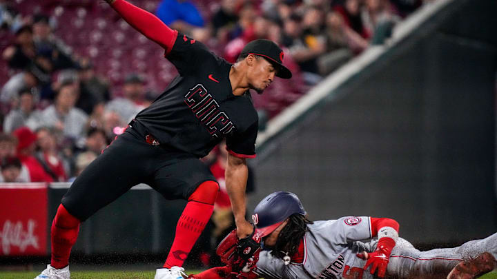 Washington Nationals shortstop CJ Abrams (5) is caught stealing by Cincinnati Reds third baseman Noelvi Marte (16) in the eighth inning of the MLB National League game between the Cincinnati Reds and the Washington Nationals at Great American Ball Park in downtown Cincinnati on Friday, May 2, 2025.