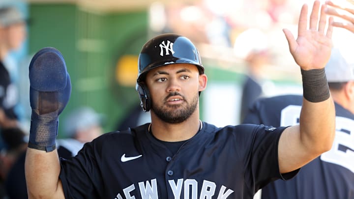 Mar 19, 2025; Clearwater, Florida, USA;  New York Yankees outfielder Jasson Dominguez (24) scores a run during the fourth inning against the Philadelphia Phillies  at BayCare Ballpark. 