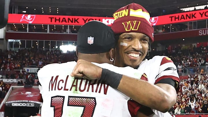 Jan 12, 2025; Tampa, Florida, USA; Washington Commanders quarterback Jayden Daniels (5) celebrates with wide receiver Terry McLaurin (17) after winning a NFC wild card playoff against the Tampa Bay Buccaneers at Raymond James Stadium. Mandatory Credit: Kim Klement Neitzel-Imagn Images