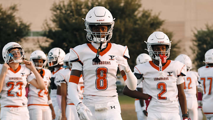 Adrian Peterson Jr. (8) is making headlines already as a 14-year-old. Son of former NFL MVP running back Adrian Peterson.