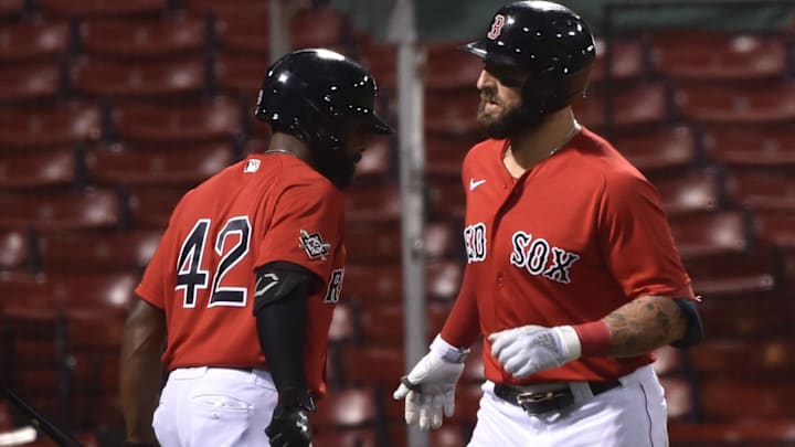 Former Boston Red Sox right fielder Kevin Pillar (right) is congratulated by center fielder Jackie Bradley Jr. (left) at Fenway Park.