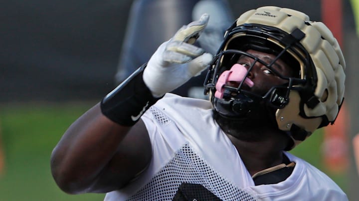 Purdue Boilermakers defensive lineman Jamarrion Harkless (97) runs a drill Friday, Aug. 16, 2024, during Purdue football practice at Bimel Outdoor Practice Complex in West Lafayette, Ind. Purdue Boilermakers defensive lineman Jamarrion Harkless (97) runs a drill Friday, Aug. 16, 2024, during Purdue football practice at Bimel Outdoor Practice Complex in West Lafayette, Ind.