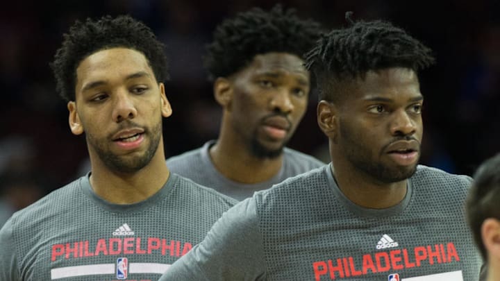 Jan 18, 2017; Philadelphia, PA, USA; From left to right Philadelphia 76ers center Jahlil Okafor (8) and center Joel Embiid (21) and center Nerlens Noel (4) warm up before the game against the Toronto Raptors at Wells Fargo Center. Mandatory Credit: Bill Streicher-Imagn Images